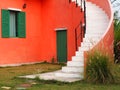 Vintage Style building.The window and door on the wall with curved stairs in the datyime.