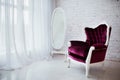 Vintage style chair in classical interior room with big window and mirror