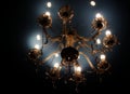 Vintage style chandelier with light reflection on the ceiling