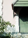 The vintage style concept of the background of the building wall with doors and trees is an element Royalty Free Stock Photo