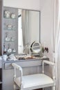 Vintage style dressing room with classic white chair and dressing table