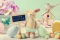 Vintage style easter card with clay rabbit and decorations on m Royalty Free Stock Photo