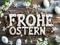 Vintage style Easter decoration with eggs and flowers. Wooden letters German text