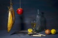 Vintage style food still life with smoked fish kipper wine and