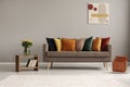 Grey living room interior with trendy sofa Royalty Free Stock Photo