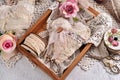 Vintage style handicraft heart made of linen and laces in wooden box