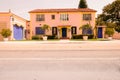 Vintage-style house, with its sloped tiled roof, ornate chimney and classical facade