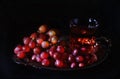 Vintage style image of red grapes in a silver antique tray