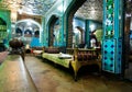 Vintage style interior of traditional persian restaurant with old ottoman couches