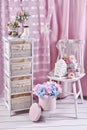 Vintage style interior with white shelves and old chair with decors