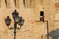 Vintage style lantern before old fortress wall. Spilamberto, Italy Royalty Free Stock Photo