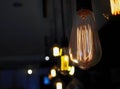 Vintage style light bulbs hanging on ceiling. Decorative lights. Old Edison bulb Royalty Free Stock Photo