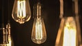 Vintage style light bulbs hanging from the ceiling. Old Edison bulb Royalty Free Stock Photo