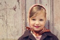 Vintage style. Little cute girl on the background of the old doo Royalty Free Stock Photo