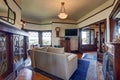 Vintage style living room with fireplace and antique wooden cabinet.