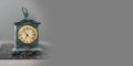 Vintage style miniature clock on grey banner template Royalty Free Stock Photo