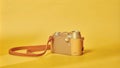 Vintage style minimalist camera against bright yellow background Royalty Free Stock Photo