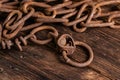 Vintage style, old rusty steel chain, on wooden background Royalty Free Stock Photo