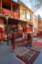 Tbilisi, Georgia, 18 December 2019 - vintage style Oriental carpets stacks on a street carpets market