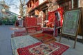 Tbilisi, Georgia, 18 December 2019 - vintage style Oriental carpets stacks on a street carpets market