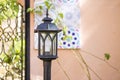 Vintage style outdoor garden lamp over blurred background