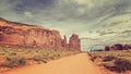 Vintage style photo of sandy road in Monument Valley, USA. Royalty Free Stock Photo