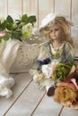 Vintage style picture with bunch of roses and vintage doll