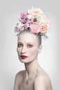 Vintage style portrait of beautiful girl with fancy flower hairdo Royalty Free Stock Photo