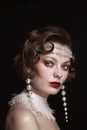 Vintage style portrait of beautiful woman with fancy pearl earrings Royalty Free Stock Photo
