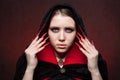 Vintage style portrait of young beautiful vampire woman with gothic Halloween makeup Royalty Free Stock Photo