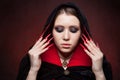 Vintage style portrait of young beautiful vampire woman with gothic Halloween makeup Royalty Free Stock Photo