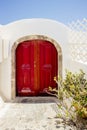 Vintage style red front door. Vastu Shastra main entrance energy flow concept. Royalty Free Stock Photo