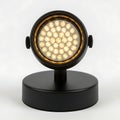 Vintage style spotlight with warm led illumination on a black base Royalty Free Stock Photo