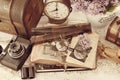 Vintage style still life with old photographs and camera in sepia Royalty Free Stock Photo