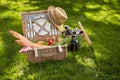 Vintage style summer picnic in a wicker basket Royalty Free Stock Photo