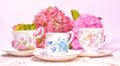 Attractive fine bone china tea cups on a pink background