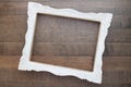 Vintage style white picture frame on wooden wall, Blank for copy Royalty Free Stock Photo