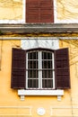 Vintage style window on yellow house