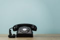 Vintage Styled Rotary Phone on wooden table.  3d illustration Royalty Free Stock Photo