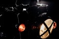 Vintage styled scrambler motorcycle on washing. Headlights at night. Classic black motorbike. Caferacers style Royalty Free Stock Photo