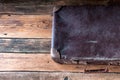 Vintage suitcase on wooden floor. Copyspace. Top view Royalty Free Stock Photo