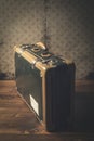 Vintage suitcase on a wooden floor Royalty Free Stock Photo