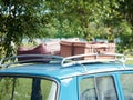 Vintage suitcases on the trunk of the roof of an old car Royalty Free Stock Photo