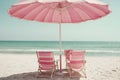 Vintage summer beach with pink pastel parasol Royalty Free Stock Photo
