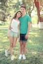 Vintage summer portrait modern couple teenagers in the park