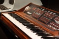 Vintage synthesizer made of wood and full of music vibes