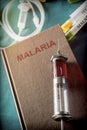 Vintage Syringe On A Book Of Malaria Royalty Free Stock Photo