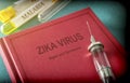 Vintage Syringe On A Book Of Zica Virus
