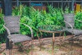 A vintage table and chairs are made wicker weave