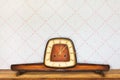 Vintage table clock in front of retro wallpaper Royalty Free Stock Photo